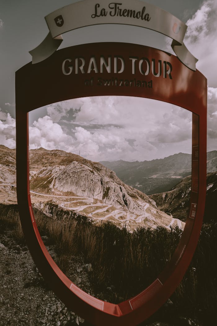 Services Discover the stunning Tremola Pass on the Grand Tour of Switzerland captured through an iconic red frame.